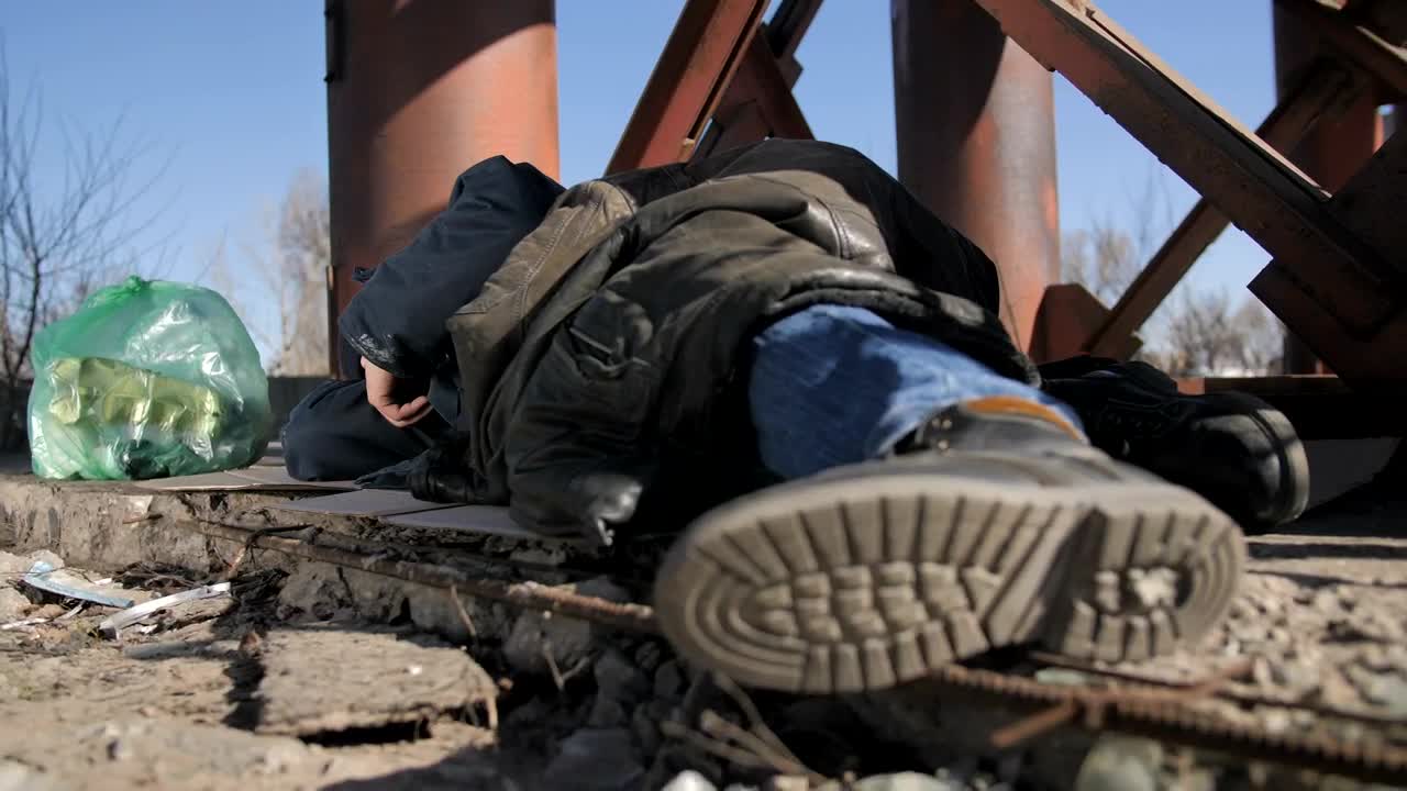 Download Stock Video Homeless Man Laying Down Animated Wallpaper