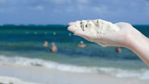 Stock Video Holding Up White Sand Animated Wallpaper