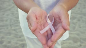 Stock Video Holding The Pink Cancer Ribbon Animated Wallpaper