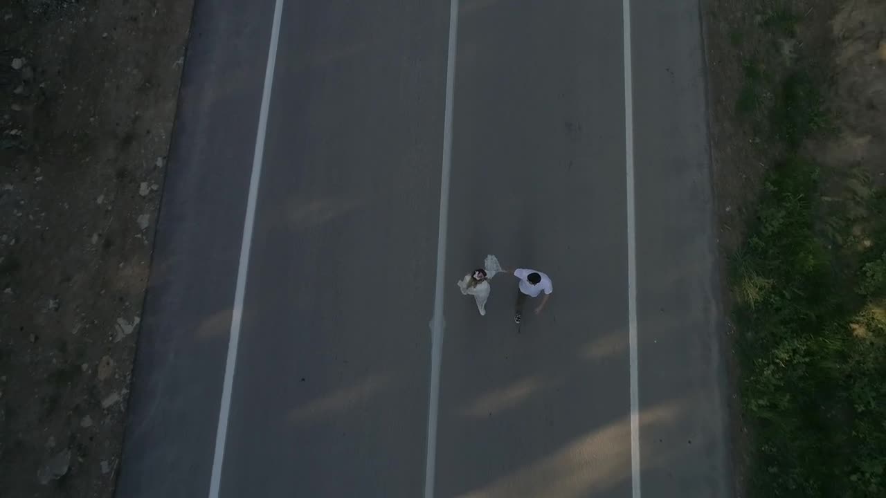 Download Stock Video Holding Hands While Walking Down A Road Animated Wallpaper