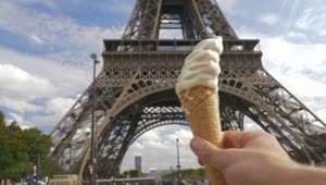 Stock Video Holding An Ice Cream By The Eiffel Tower Animated Wallpaper
