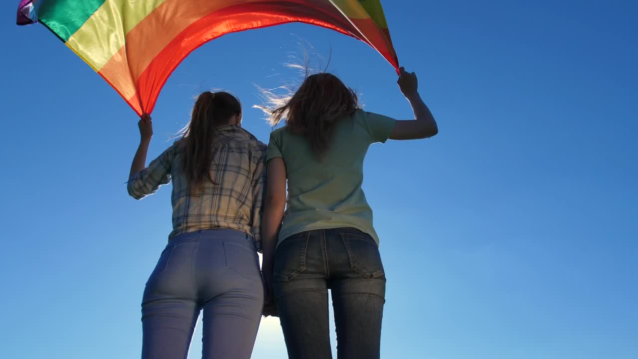 Download Stock Video Holding A Rainbow Flag In The Wind Animated Wallpaper