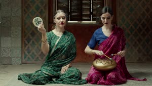 Stock Video Hindu Stylish Women Playing Music Animated Wallpaper