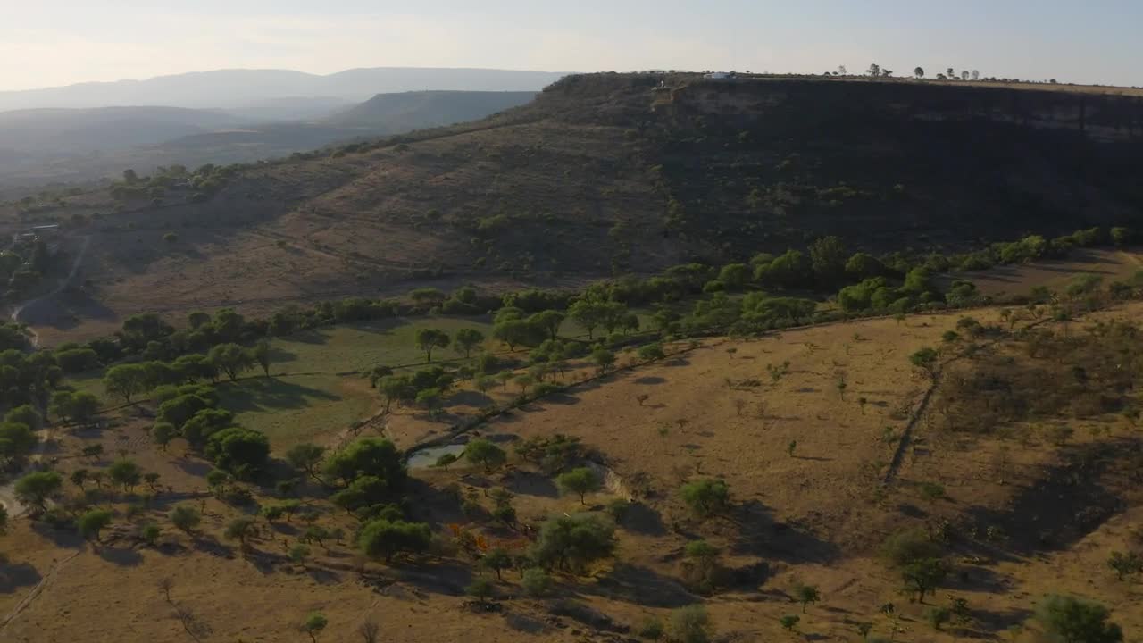 Download Stock Video Hill In The Middle Of A Mountain Range Animated Wallpaper