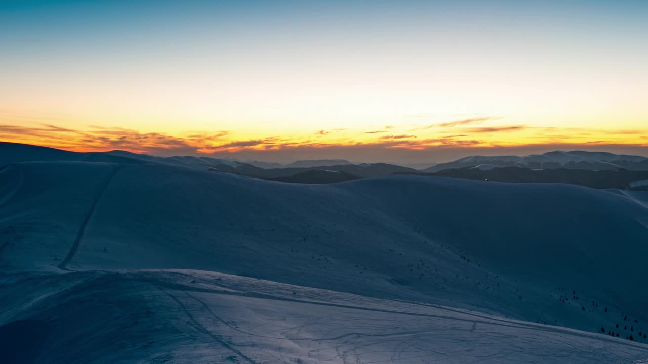 Download Stock Video Hill Covered With Snow During A Sunrise Animated Wallpaper