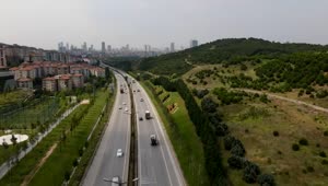 Stock Video Highway Surrounded By Nature And Buildings Animated Wallpaper