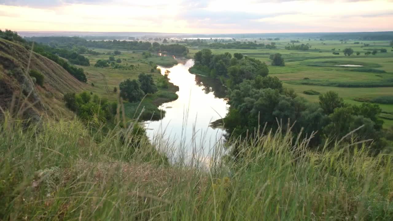 Download Stock Video High View Of A River Between Fields Animated Wallpaper