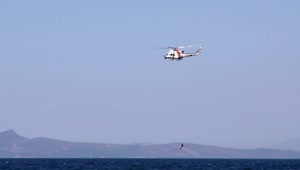 Stock Video Helicopter Rescuing Diver From The Sea Animated Wallpaper
