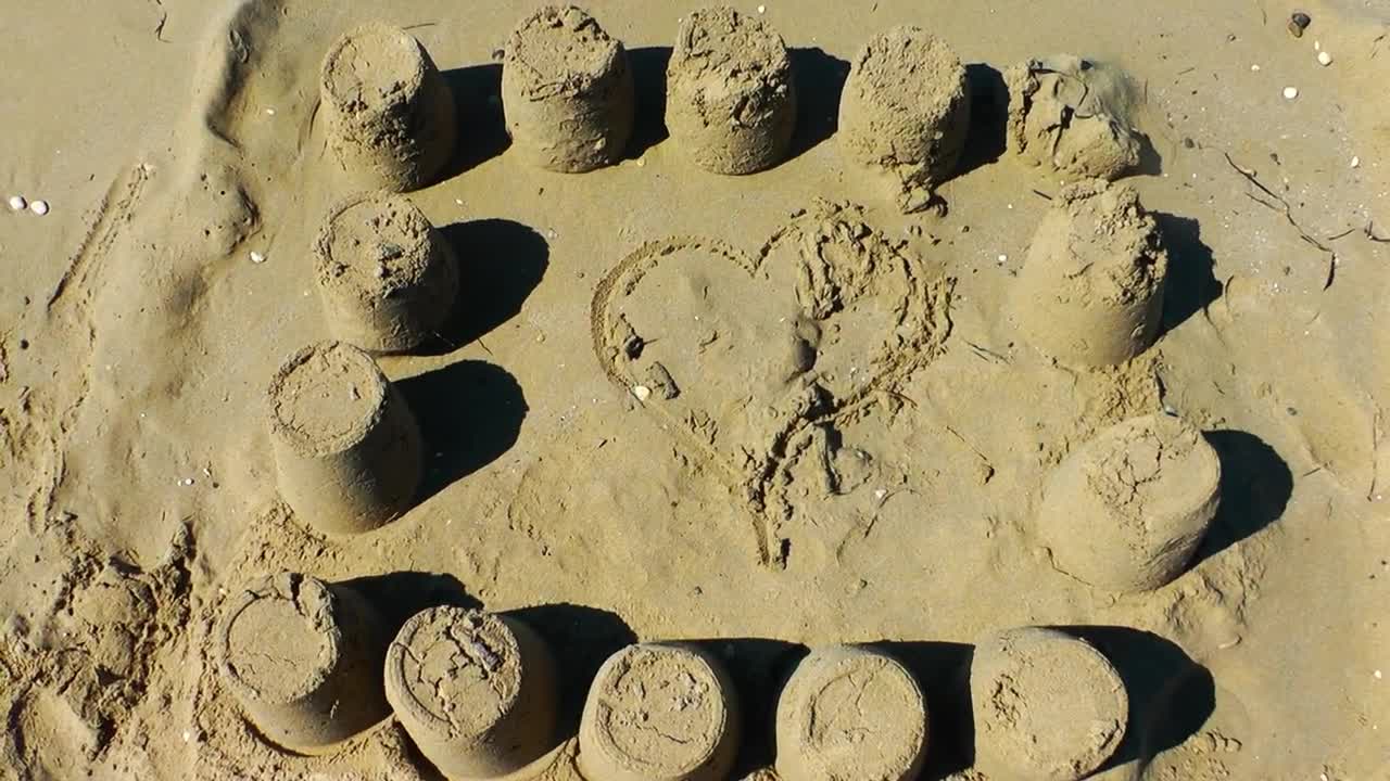 Download Stock Video Heart In The Sand By The Sea Animated Wallpaper