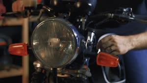 Stock Video Headlight Of A Motorcycle That Is Turned On By A Animated Wallpaper