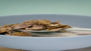 Stock Video Having A Tablespoon Of Healthy Cereal With Milk Animated Wallpaper