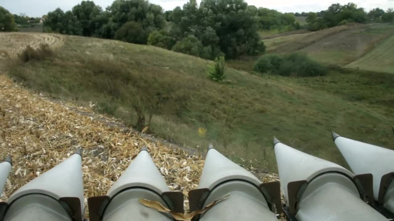 Download Stock Video Harvester Moving Through A Finished Field Animated Wallpaper