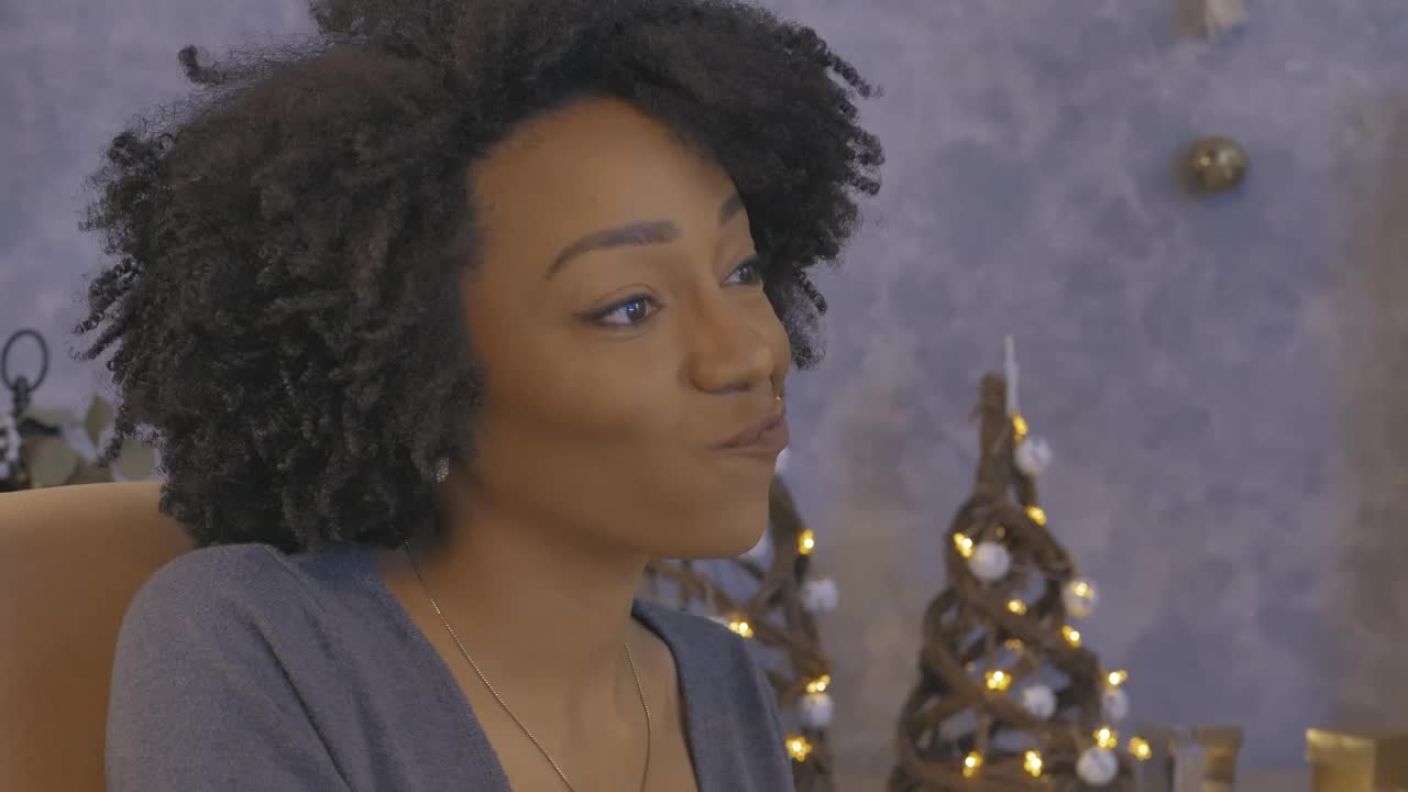 Download Stock Video Happy Young Woman During A Christmas Dinner Animated Wallpaper