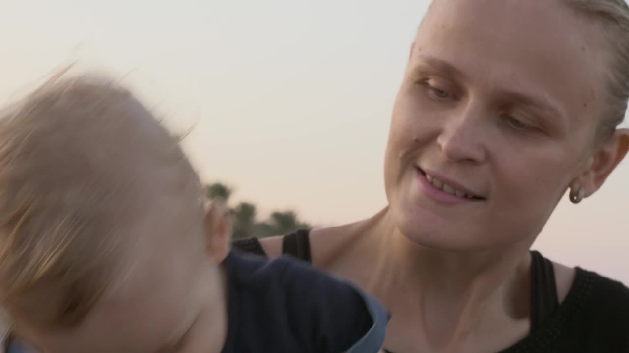 Download Stock Video Happy Young Mother Animated Wallpaper