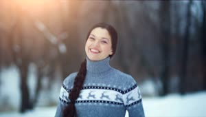 Stock Video Happy Woman With Thumbs Up In Snowy Forest Animated Wallpaper