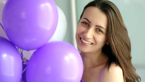 Stock Video Happy Woman With Purple And White Balloons Portrait Animated Wallpaper