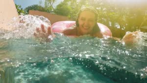Stock Video Happy Woman Playing With Water In A Swimming Pool Animated Wallpaper