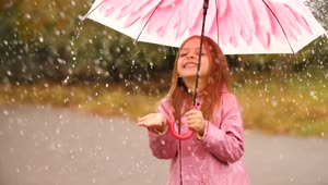 Stock Video Happy Girl With An Umbrella In The Rain Animated Wallpaper