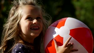 Stock Video Happy Girl With An Inflatable Ball Animated Wallpaper