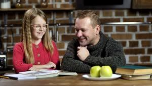 Stock Video Happy Father And Daughter Studying Together Animated Wallpaper