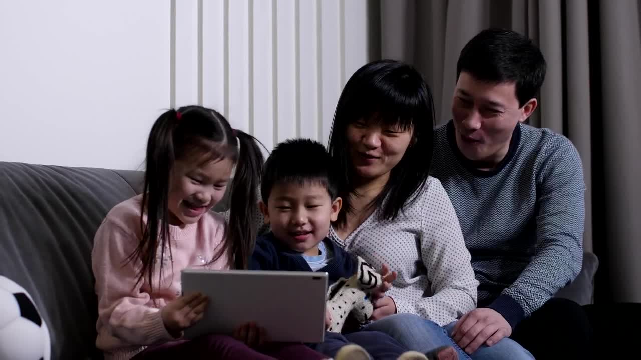 Download Stock Video Happy Family Watching A Video Together Animated Wallpaper