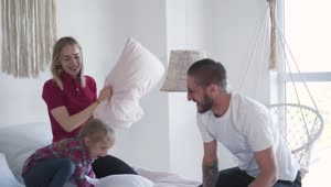 Stock Video Happy Family Playing With Pillows Animated Wallpaper