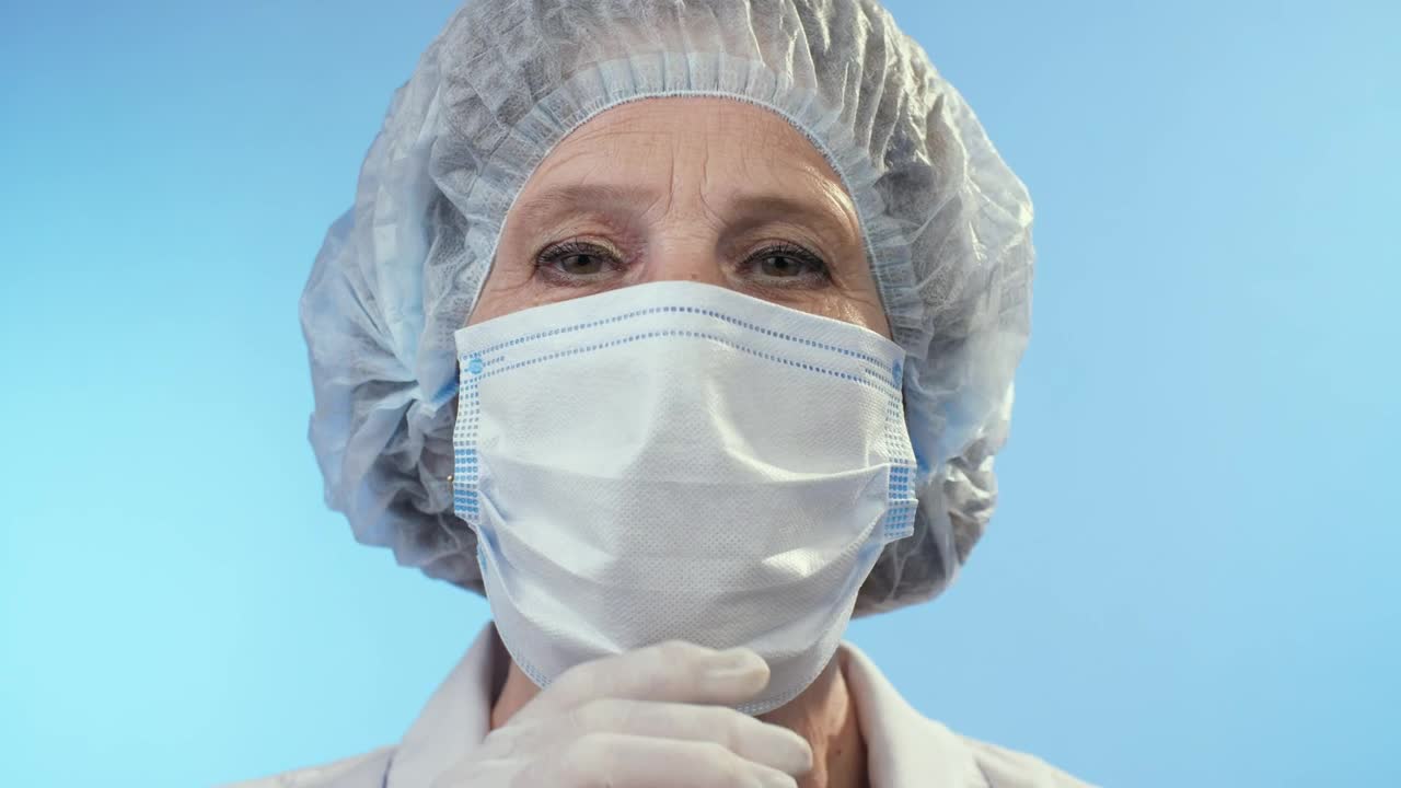 Download Stock Video Happy Doctor Takes Off The Mask Animated Wallpaper