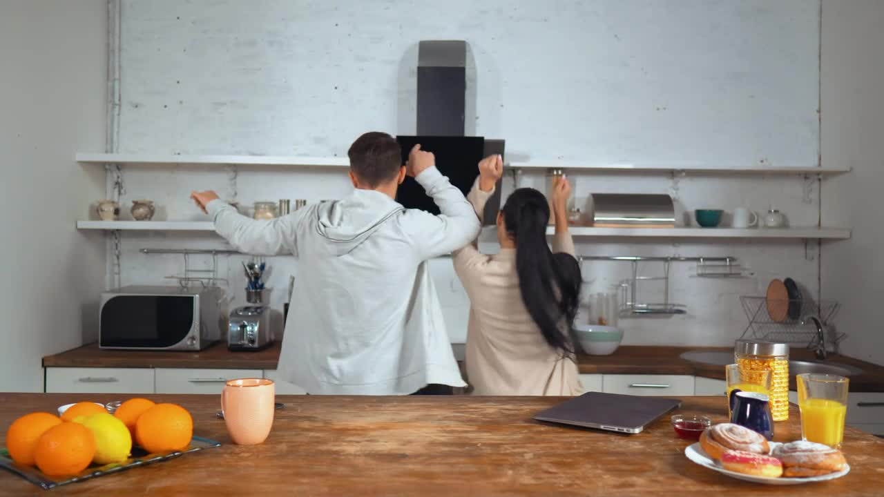Download Stock Video Happy Couple Dancing In A Kitchen Animated Wallpaper
