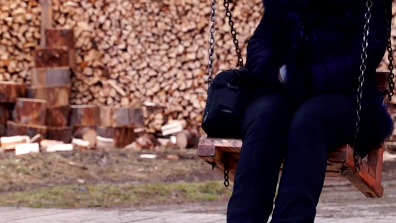 Download Stock Video Hanging Out On A Wooden Swing Animated Wallpaper