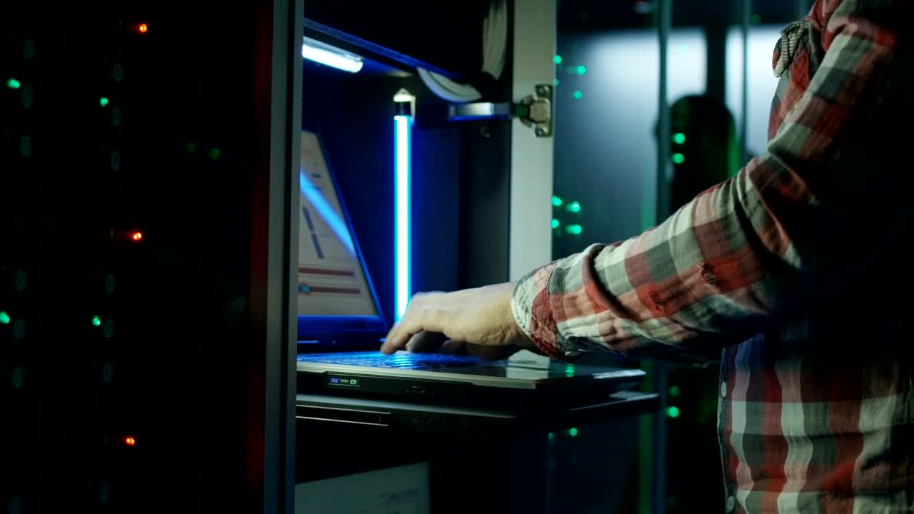 Download Stock Video Hands Working With Laptop In Datacenter Animated Wallpaper