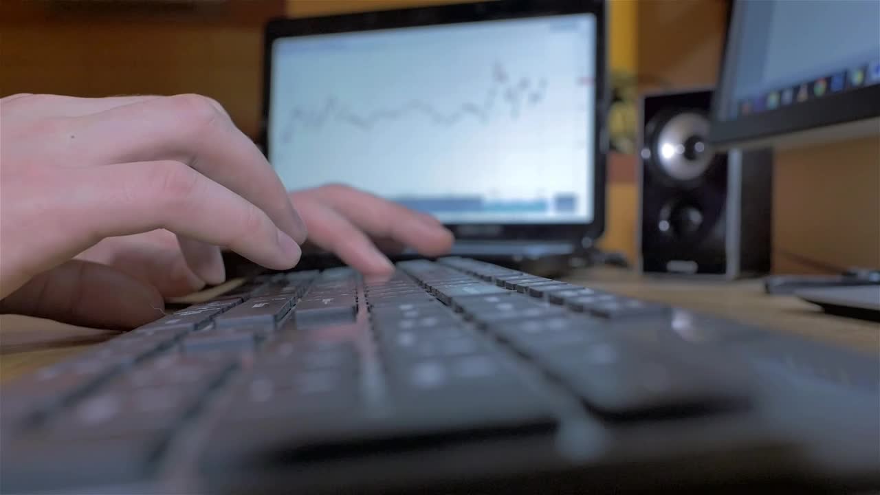 Download Stock Video Hands Typing On A Black Keyboard On A Desk Animated Wallpaper