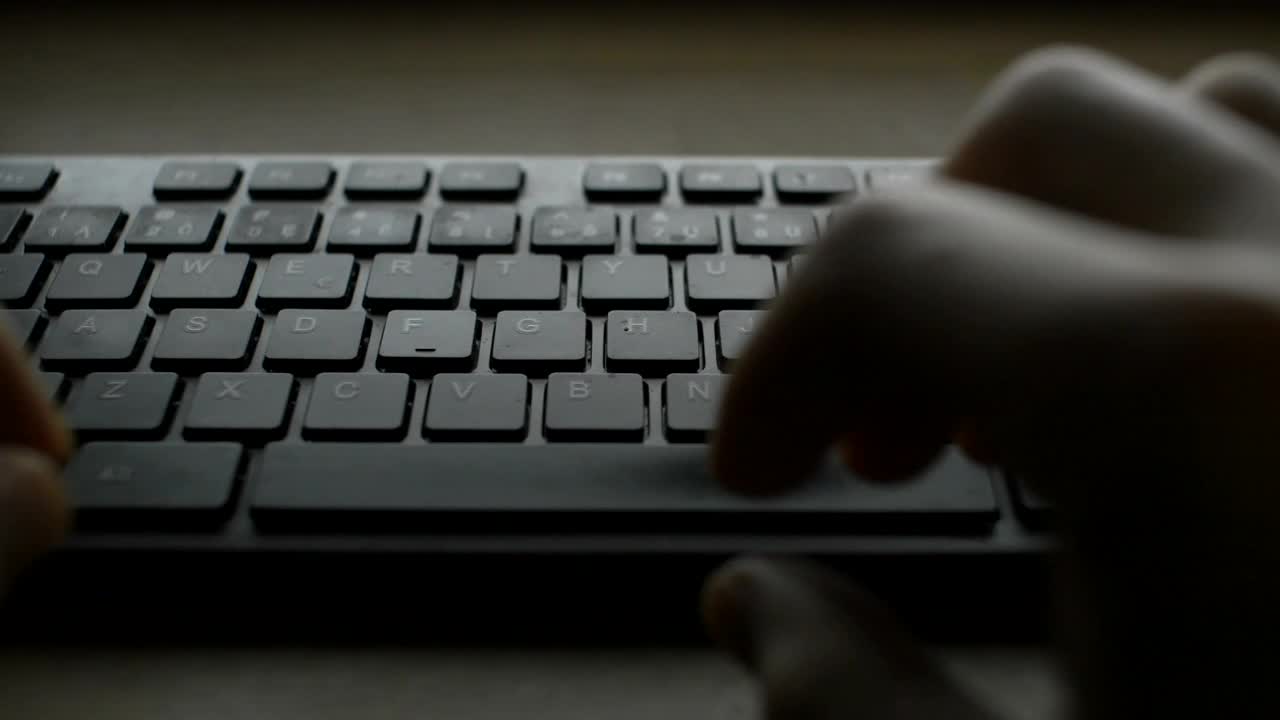 Download Stock Video Hands Typing On A Black Keyboard Animated Wallpaper