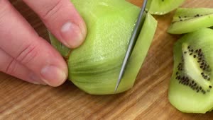 Stock Video Hands Slicing A Kiwi Animated Wallpaper