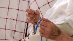 Stock Video Hands Of Old Woman Praying With The Rosary Animated Wallpaper