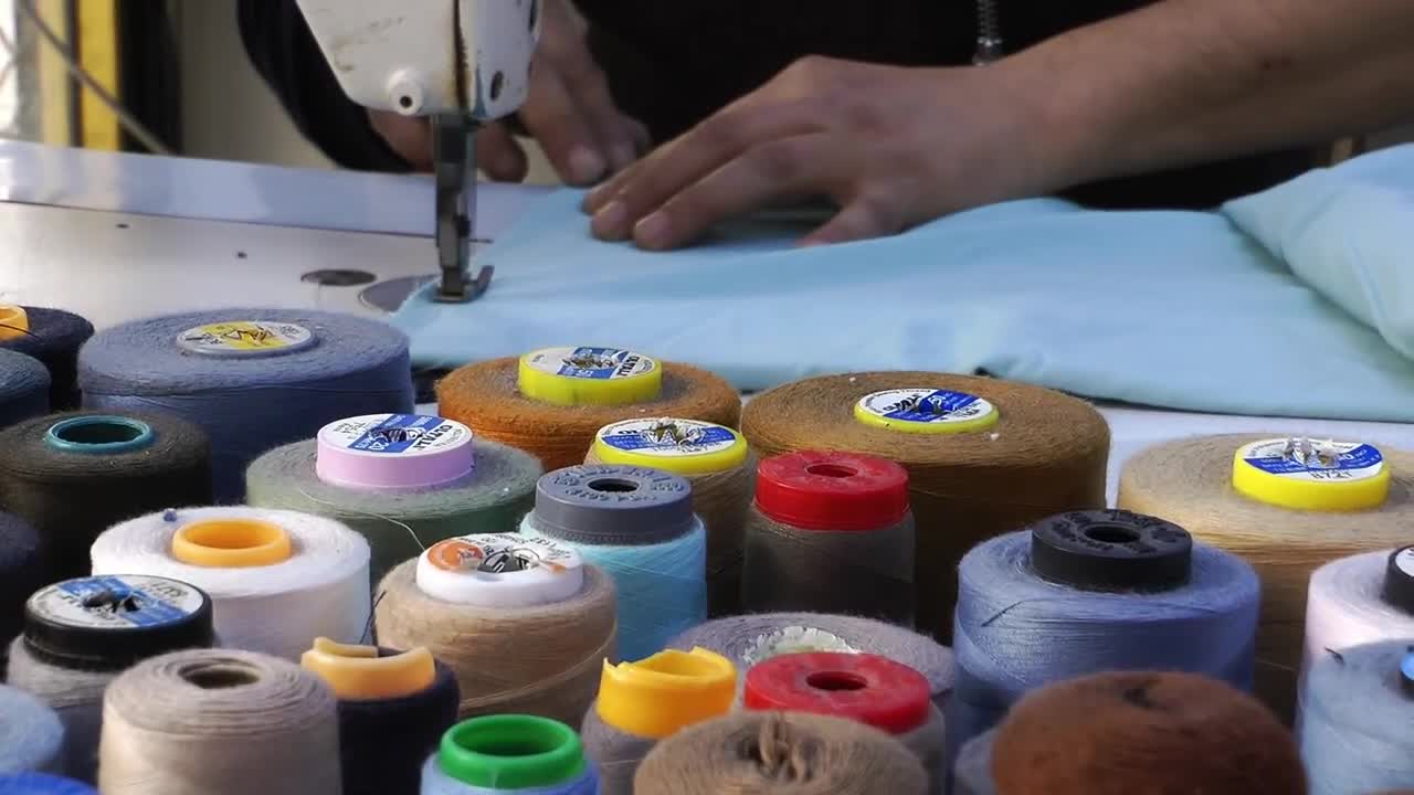 Download Stock Video Hands Of A Tailor Working Animated Wallpaper