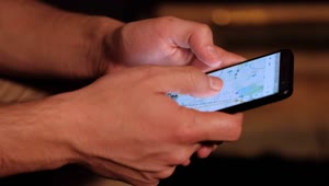 Stock Video Hands Of A Person Searching A Map On His Cell Animated Wallpaper
