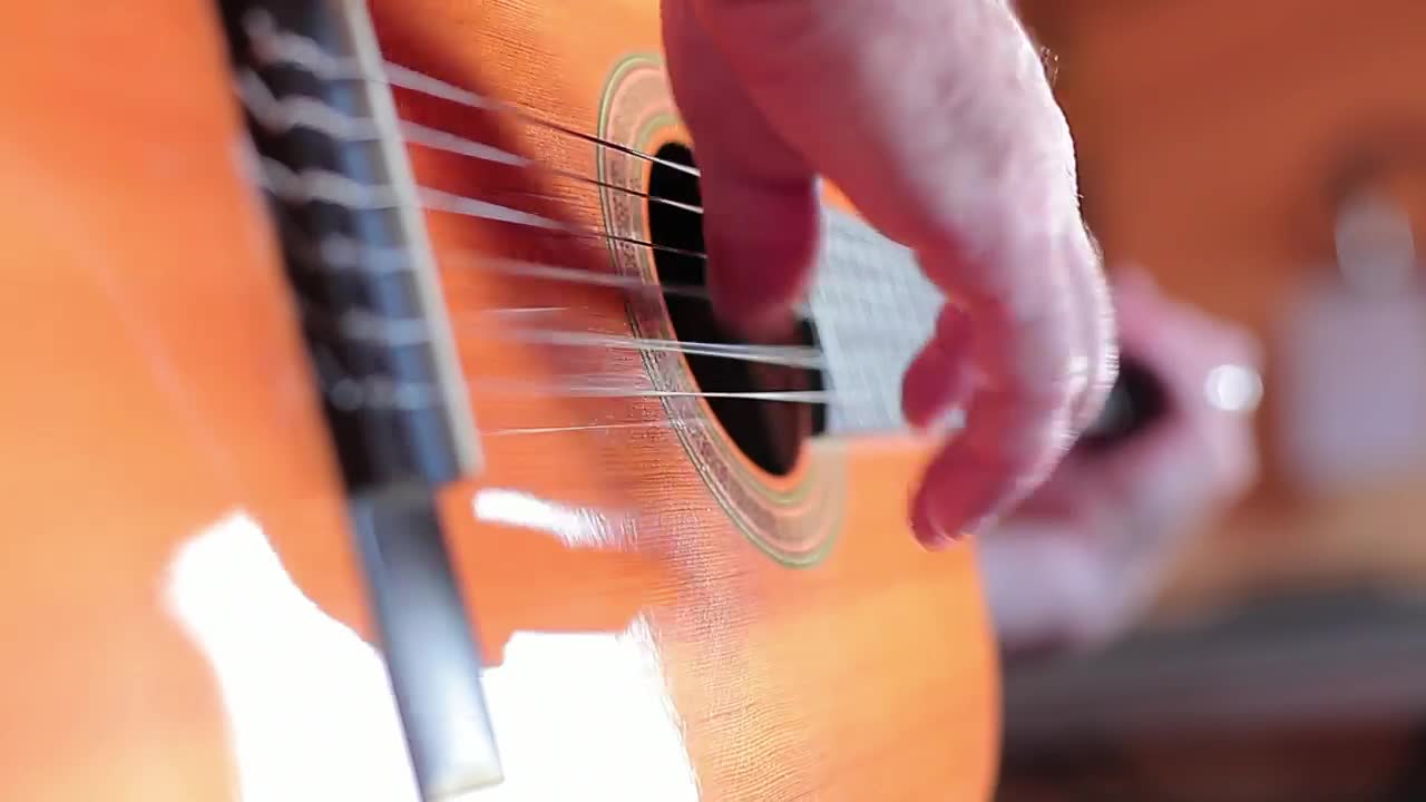 Download Stock Video Hands Of A Person Playing The Guitar Animated Wallpaper
