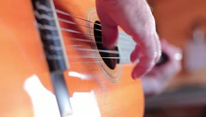 Stock Video Hands Of A Person Playing The Guitar Animated Wallpaper
