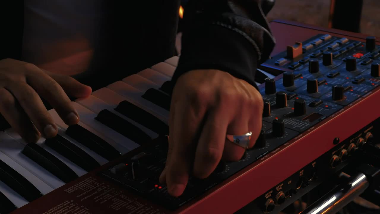 Download Stock Video Hands Of A Dj Playing A Keyboard Animated Wallpaper