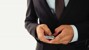 Stock Video Hands Of A Businessman Texting On A Cell Phone Animated Wallpaper