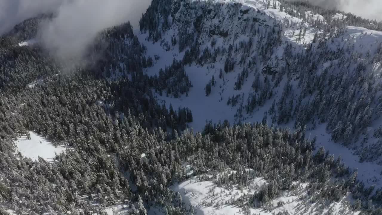 Download Stock Video Landscape Of Snowy Mountains Covered By Mist Animated Wallpaper