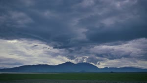 Stock Video Landscape Of An Immense Plain Surrounded By Hills Animated Wallpaper