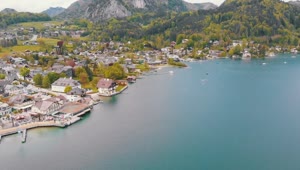 Stock Video Landscape Around A Lake With A City And Mountains Animated Wallpaper