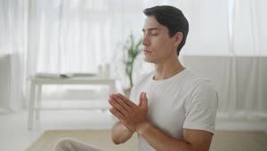 Stock Video Man In Peaceful Mind Meditation At Home Animated Wallpaper