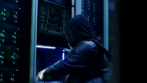 Stock Video Man In Hoodie Hacking A Data Center Animated Wallpaper
