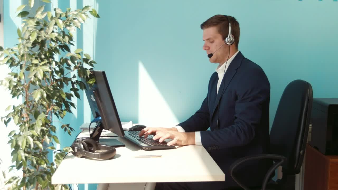 Download Stock Video Man In A Suit Working In An Office With A Animated Wallpaper
