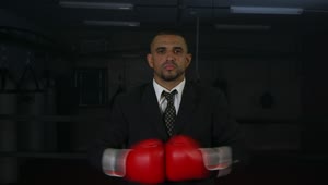 Stock Video Man In A Suit Wearing Red Boxing Gloves Animated Wallpaper
