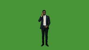 Stock Video Man In A Suit On The Phone On A Green Animated Wallpaper