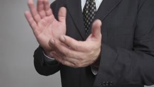 Stock Video Man In A Suit Clapping Close Up Animated Wallpaper