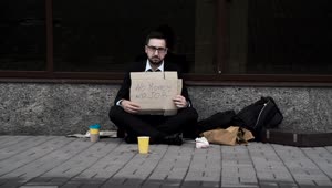 Stock Video Man In A Suit Begging On The Street Animated Wallpaper